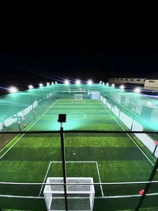 After: floodlit football turf with boundary nets and roof netting installed by YPL Safety Nets After: floodlit football turf with boundary nets and roof netting installed by YPL Safety Nets